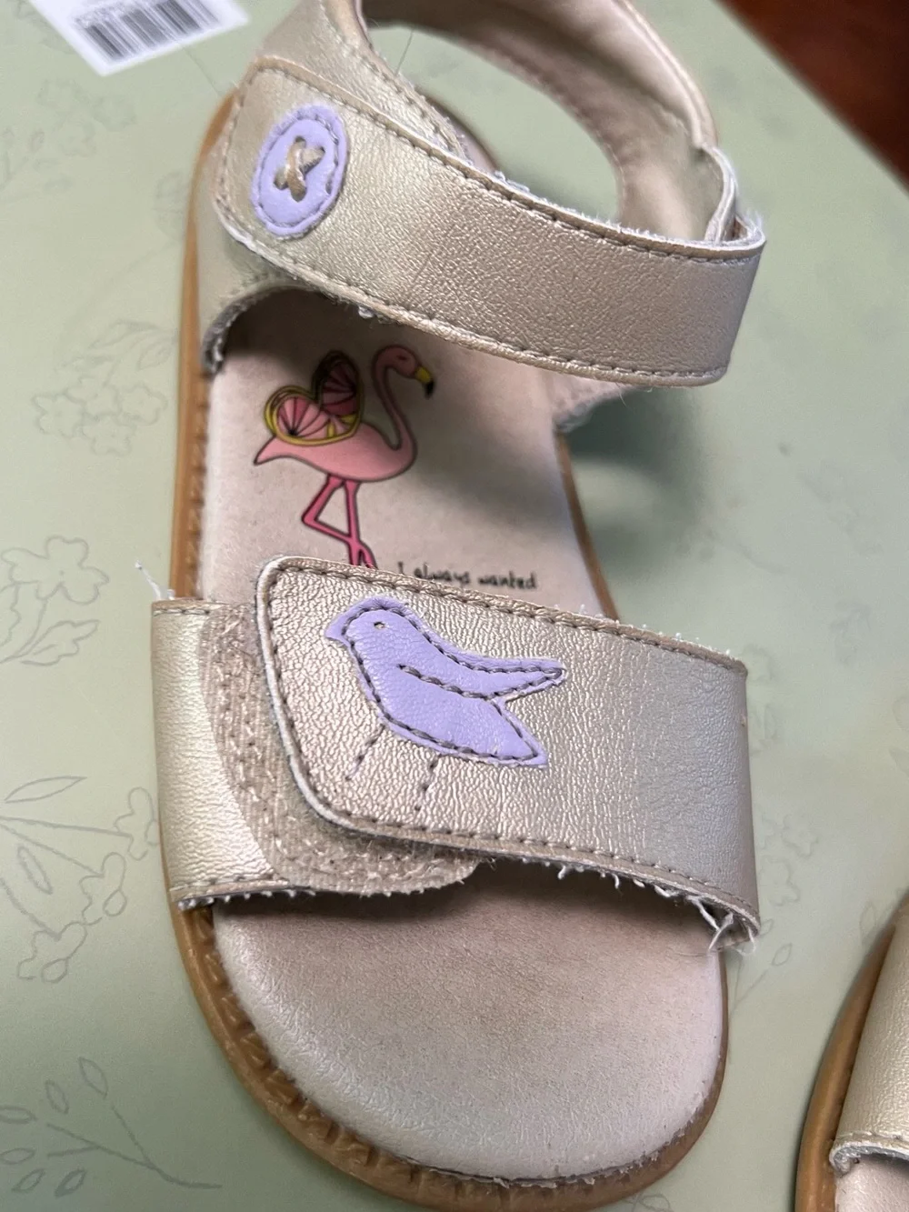 Livie & Luca Metallic Cream Sandals with Lilac Bird Detail
